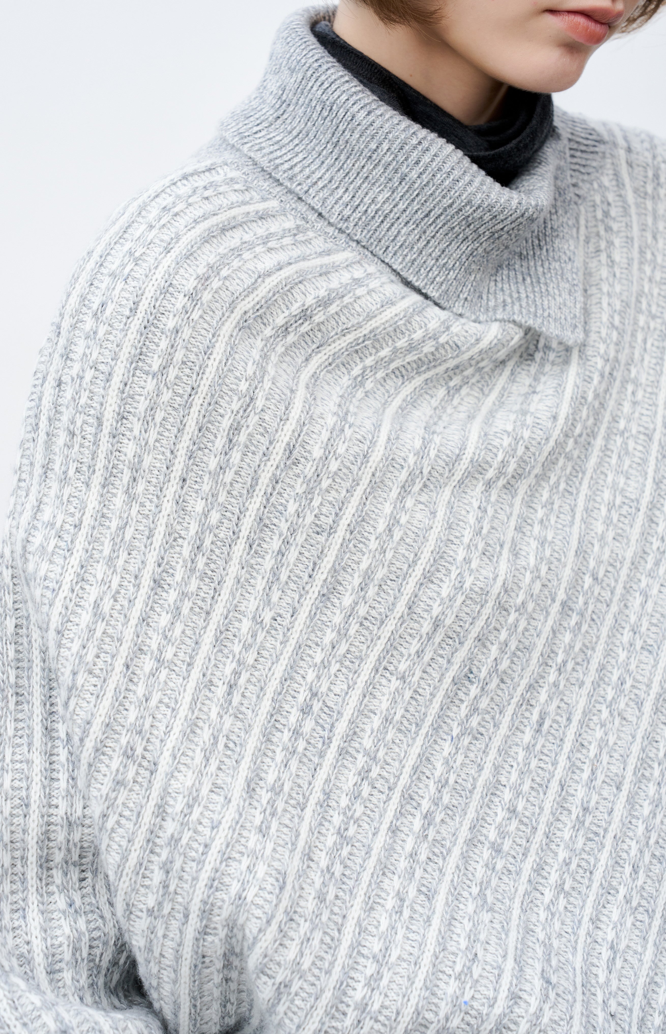 ASYMMETRIC OVER KNIT SWEATER