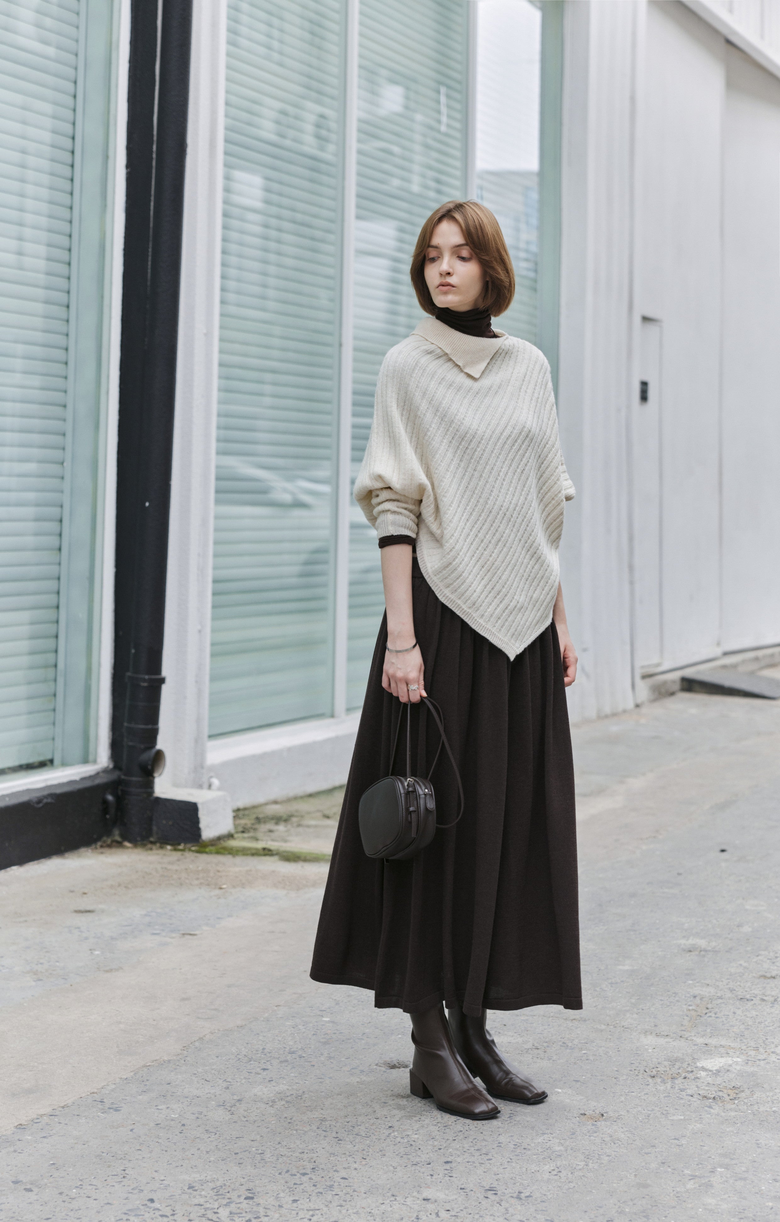 ASYMMETRIC OVER KNIT SWEATER