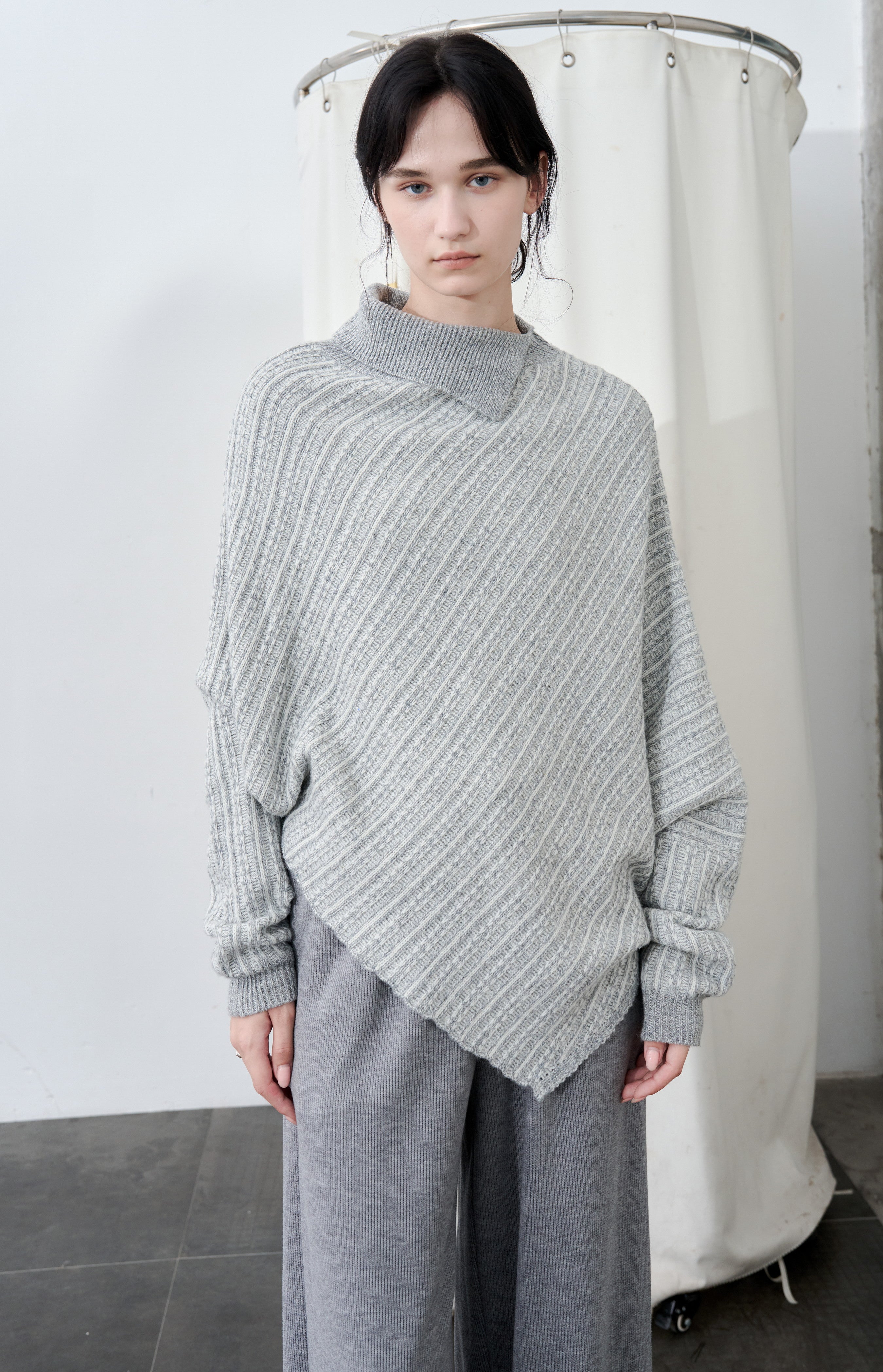 ASYMMETRIC OVER KNIT SWEATER