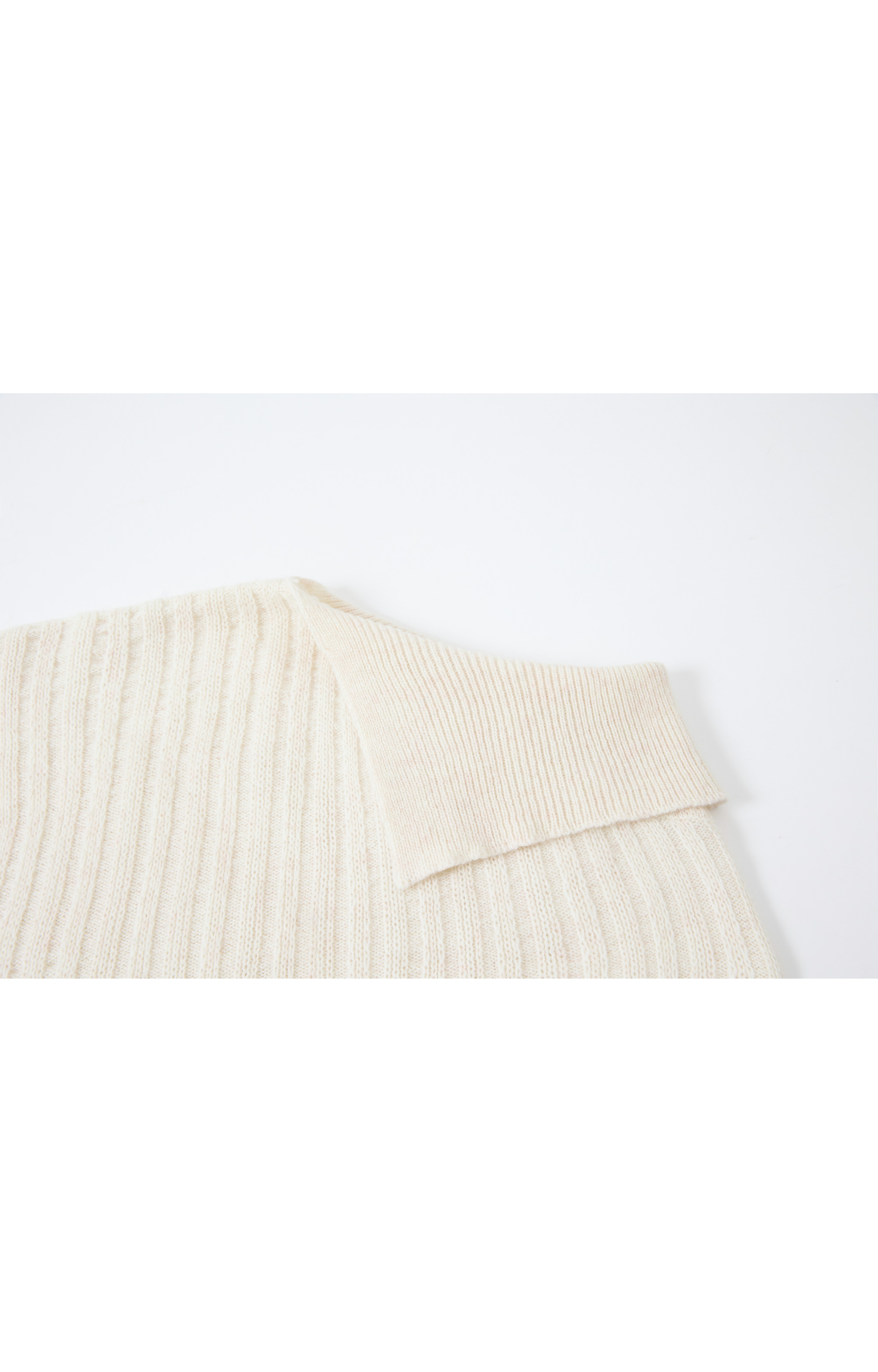 ASYMMETRIC OVER KNIT SWEATER