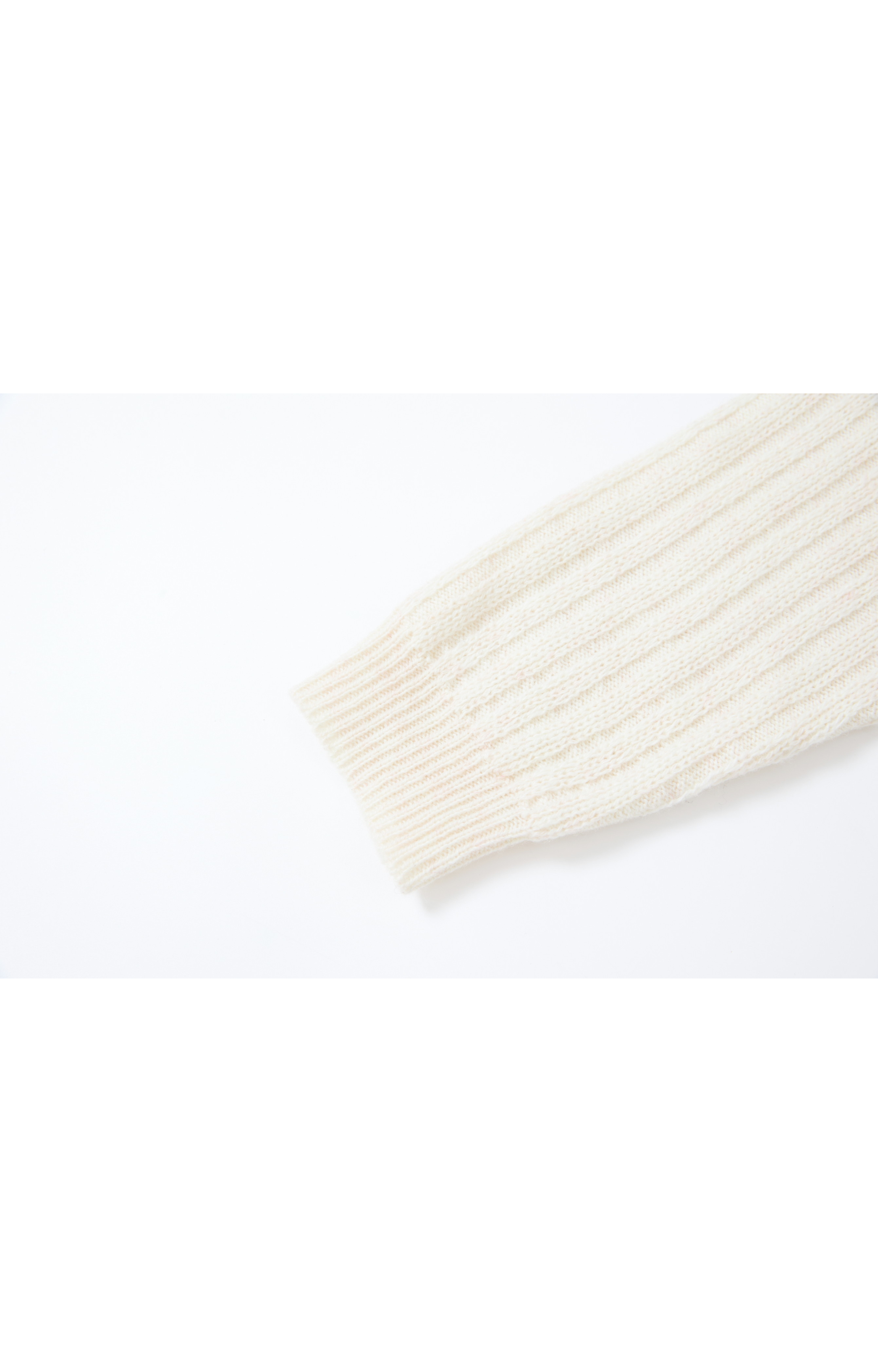 ASYMMETRIC OVER KNIT SWEATER