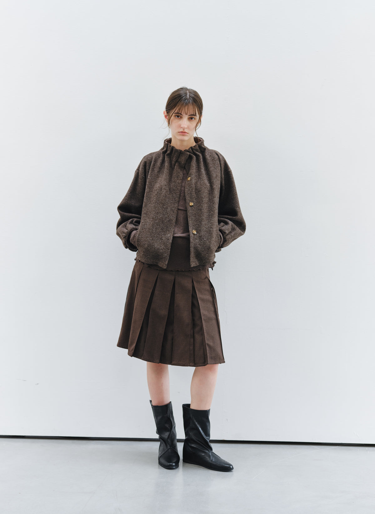 BACK LEATHER PLEATED SKIRT